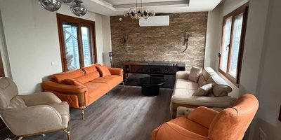 Modern yaşam alanları için turuncu ve bej koltuk takımı. İnegöl mobilya kampanyaları ile şık ve rahat oturma grubu. Ahşap detaylar.
