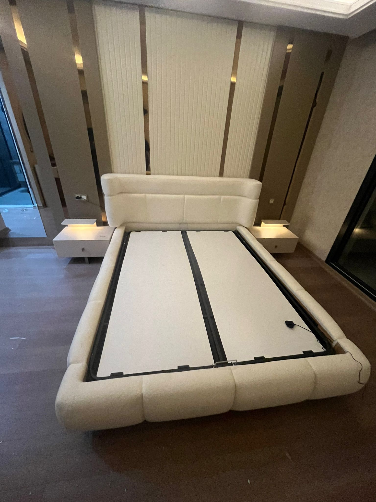 Fatih A. 2026 model, a stylish Inegol furniture set featuring a modern and comfortable white upholstered storage bed and illuminated nightstands.