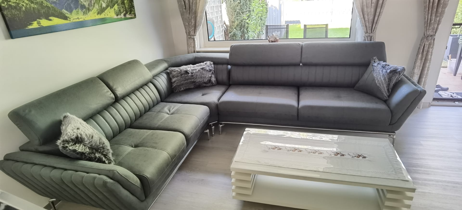 Elegant and comfortable modern grey corner sofa set with detailed stitching and metal legs, complementing Bursa furniture design.
