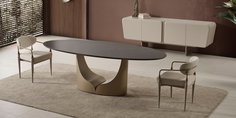 Modern oval seramik yüzeyli yemek masası, benzersiz kaideye sahip, iki konforlu sandalyeyle takım. Modern inegol mobilya zarafeti.