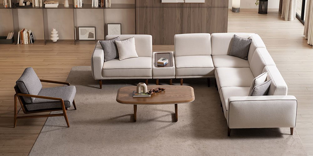 Aura Köşe Koltuk Takımı'nın modern ve konforlu tasarımıyla döşenmiş bir salon. Zarif detaylar ve doğal ışık. inegöl mobilya kampanyaları için ilham veren bir köşe.