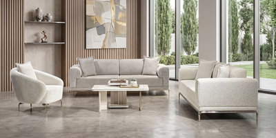 Modern salon dekorasyonunda krem renkli Şimal Koltuk Takımı ve dekoratif aksesuarlar. Kaliteli İnegöl mobilya ürünleri ile şık yaşam alanları.