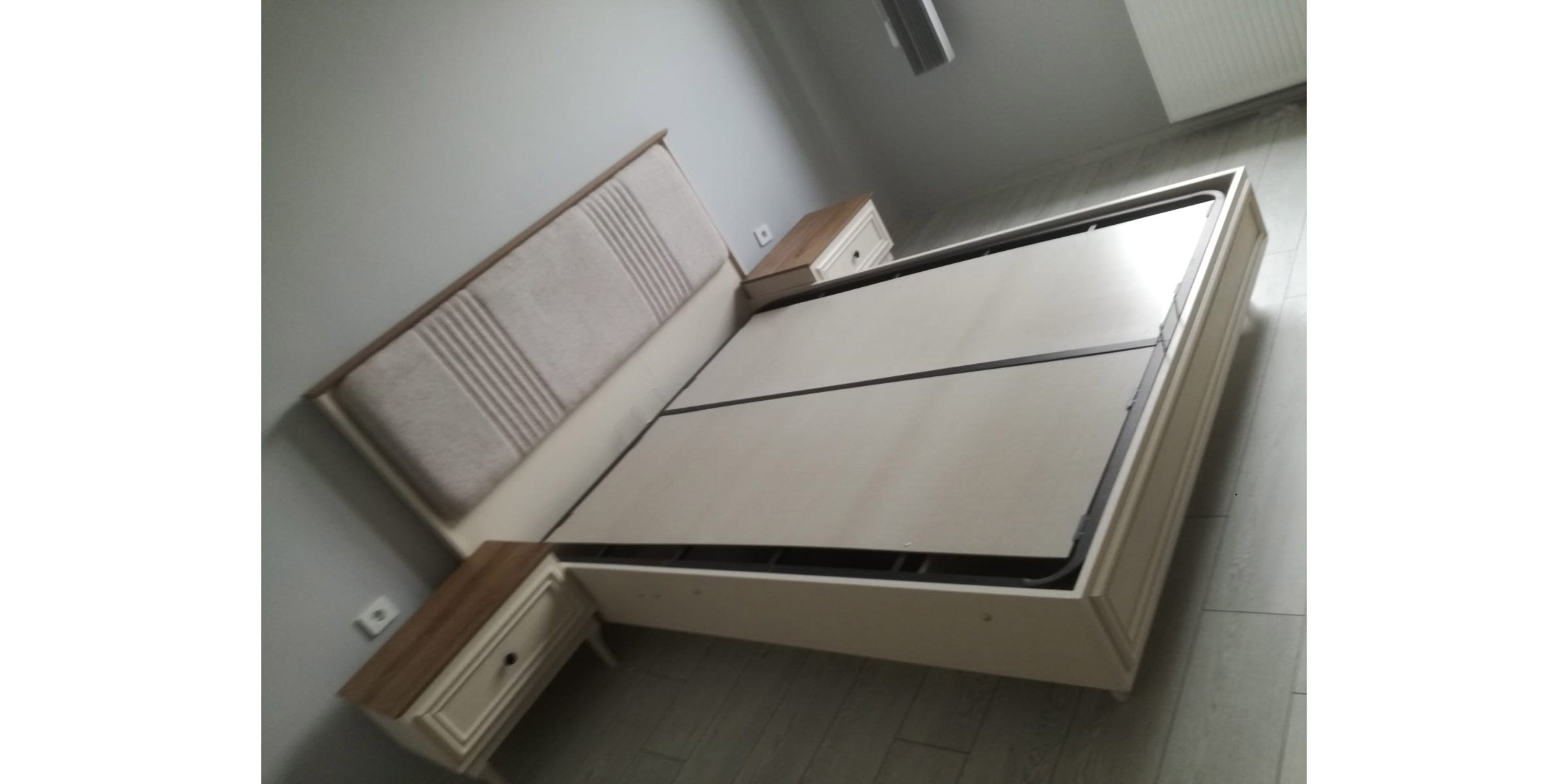 Elegant cream-colored modern bed frame with a padded headboard and two nightstands, reflecting Inegol furniture quality.