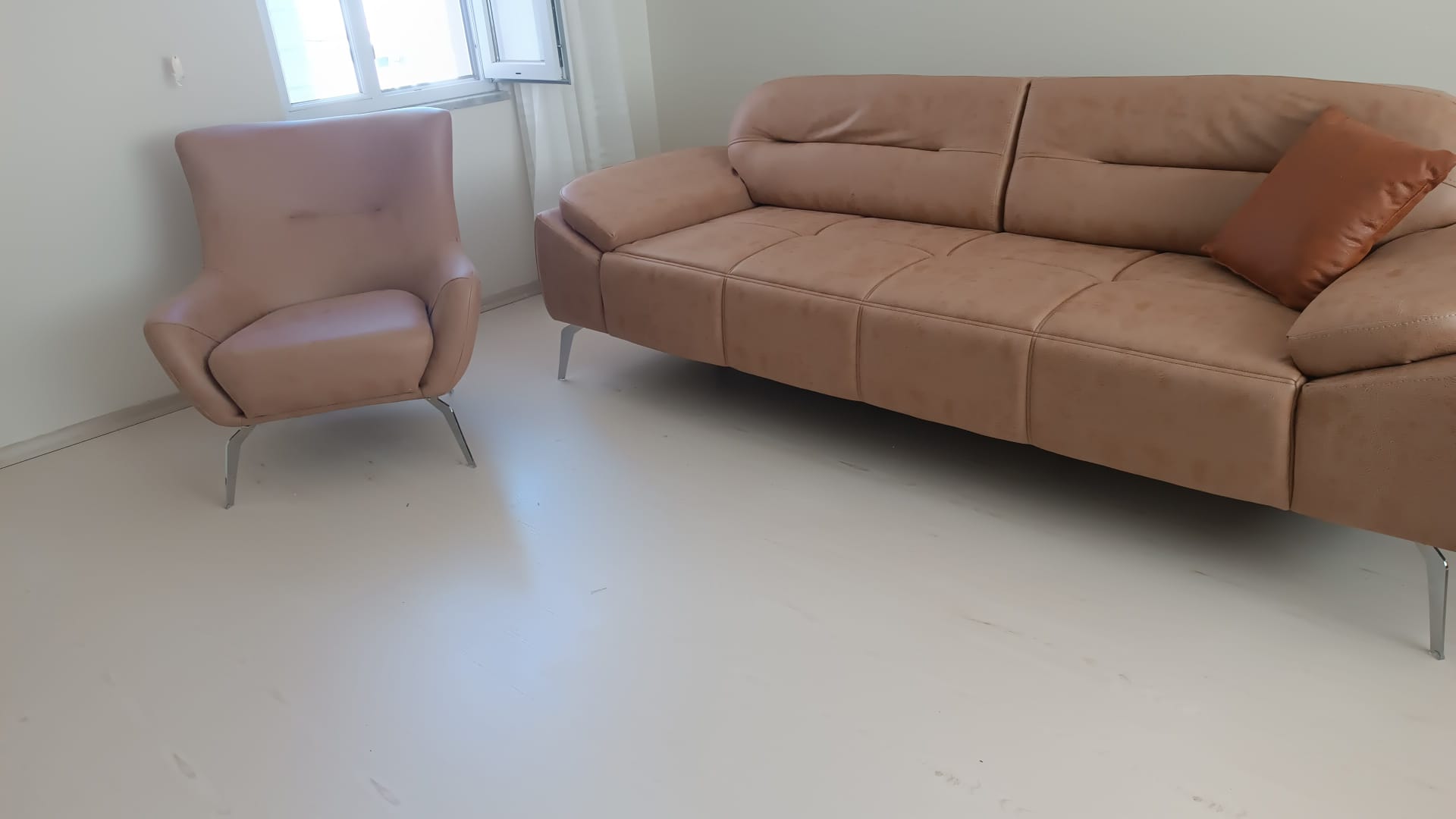 Stylish modern light beige sofa set with a comfortable three-seater sofa and a single armchair. An elegant addition to your home, part of Inegol furniture campaigns.