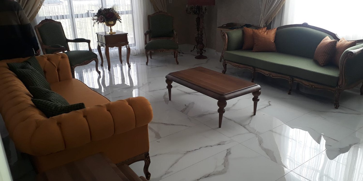 Luxury living room with mustard yellow chesterfield sofa, green classic carved sofa, armchairs, wooden coffee table. Inegol furniture models elegance.