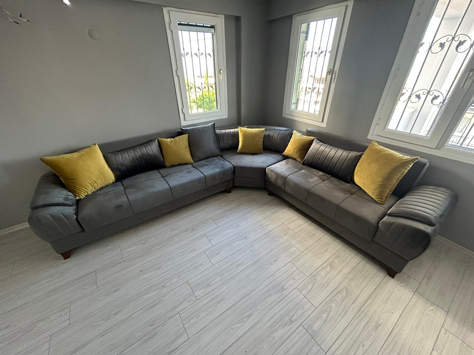 Elegant gray corner sofa set featuring yellow and gray throw cushions. This comfortable and aesthetic Zehra Deniz - Aydın corner sofa embodies Modern Inegol furniture style.