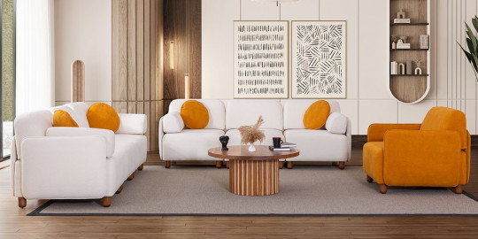 Beyaz üçlü ve ikili Puzzle koltuk takımı, canlı turuncu berjer ve yastıklarla modern bir salon, inegöl mobilya kampanyaları.