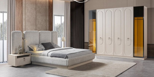 Modern ve şık Riwa Yatak Odası Takımı, krem rengi karyola, komodinler ve aynalı gardırop ile yatak odası dekorasyonu için ideal. inegöl mobilya kampanyaları ile bu takımı keşfedin.