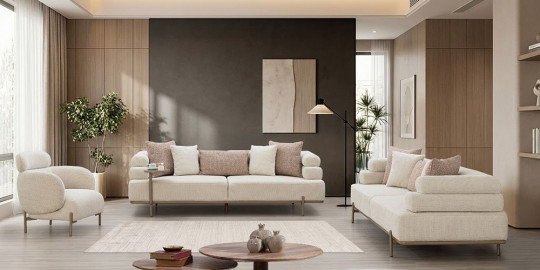 Modern Galaksi Koltuk Takımı, krem ve pembe tonlarında yastıklarla dekore edilmiş, ahşap panellerle çevrili şık bir salonda. inegöl mobilya kampanyaları arayanlara özel.