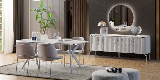 Şık gri sandalyeler ve beyaz parlak yüzeyli masadan oluşan modern Bianca Yemek Odası Takımı. Aydınlatmalı ayna ve konsolu ile tamamlanan bu İnegöl mobilyası, çağdaş bir yemek alanı sunar.